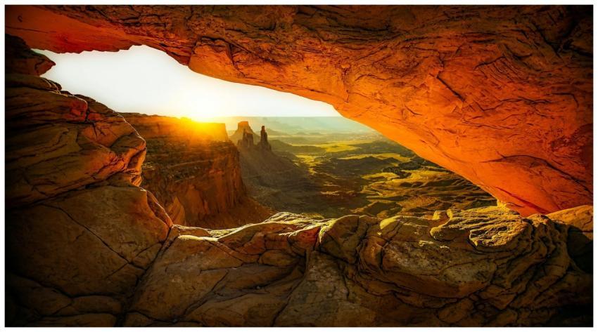 Captivating view of sunrise through Mesa Arch, sho
