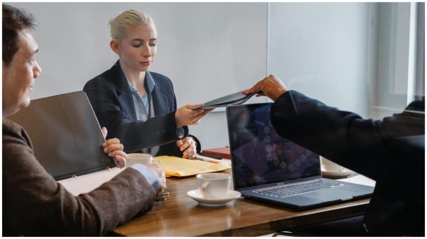 Diverse colleagues examining report of business pr