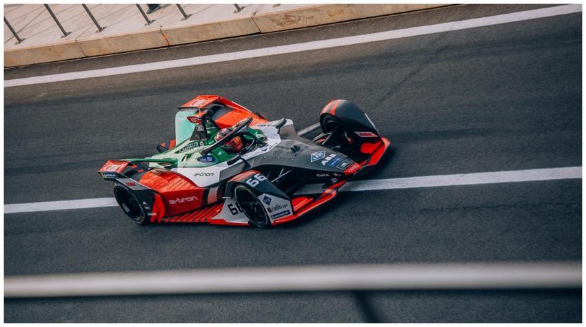 Dynamic view of a Formula E car racing on the trac