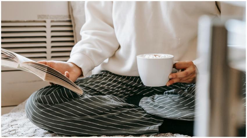 A person enjoying a cozy reading time indoors with
