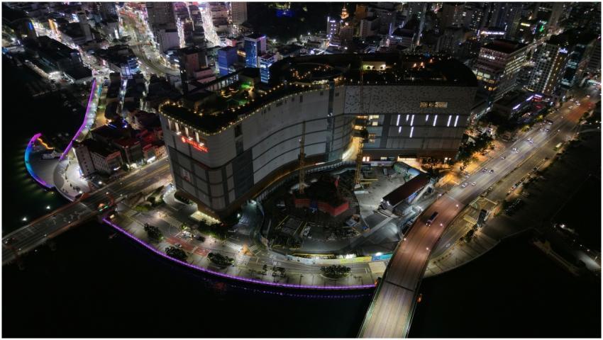 Aerial night view of Busan city showcasing vibrant