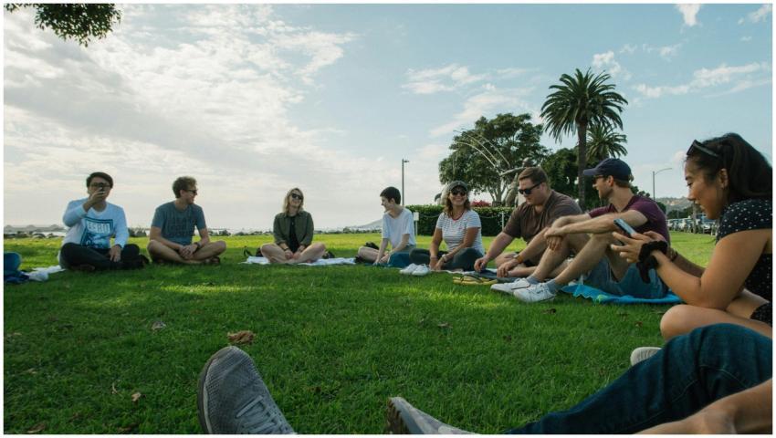 A group of friends sitting together on a sunny day