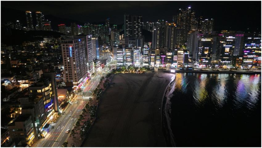 Aerial night view of Busan's illuminated skyline a