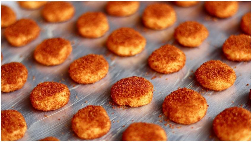 Crispy golden chicken nuggets neatly arranged on a