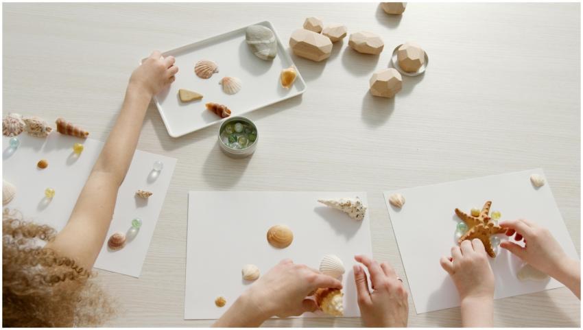 Children engaged in creative activity arranging se