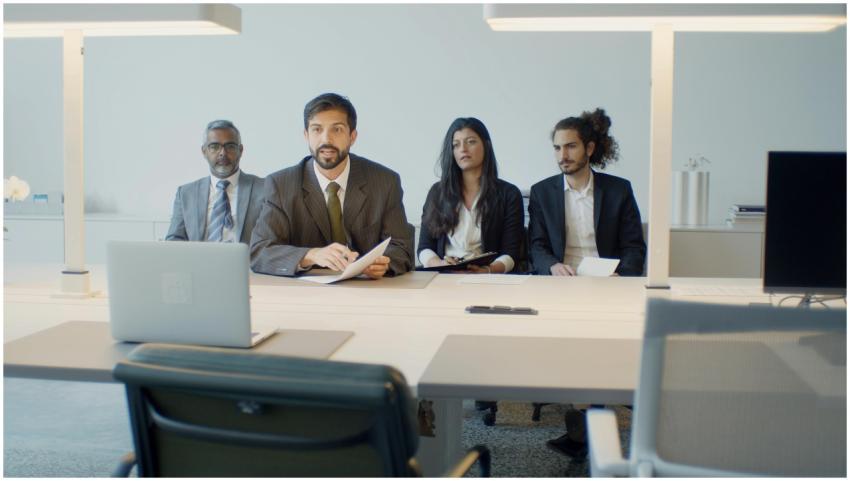 A diverse team in a business meeting using video c