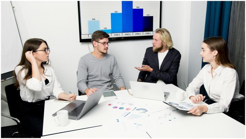 A group of business professionals discussing data
