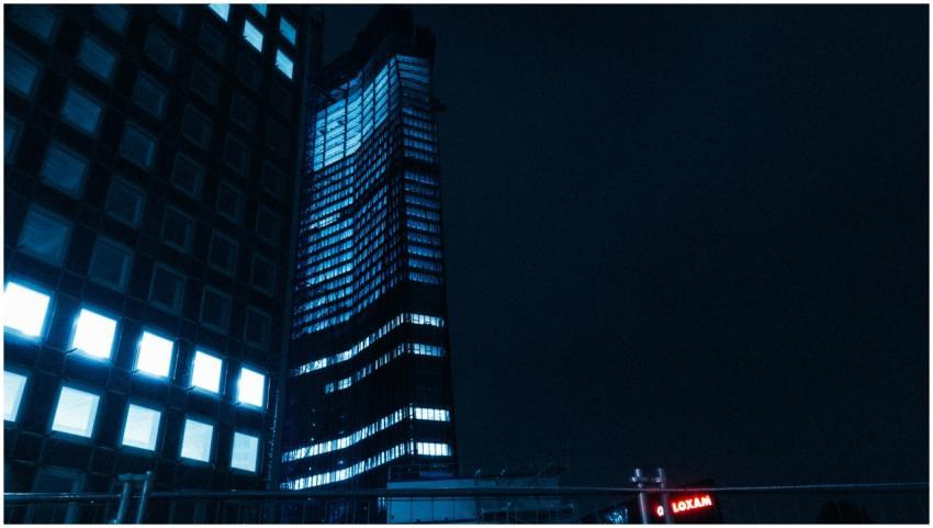 High-rise buildings illuminated at night, capturin