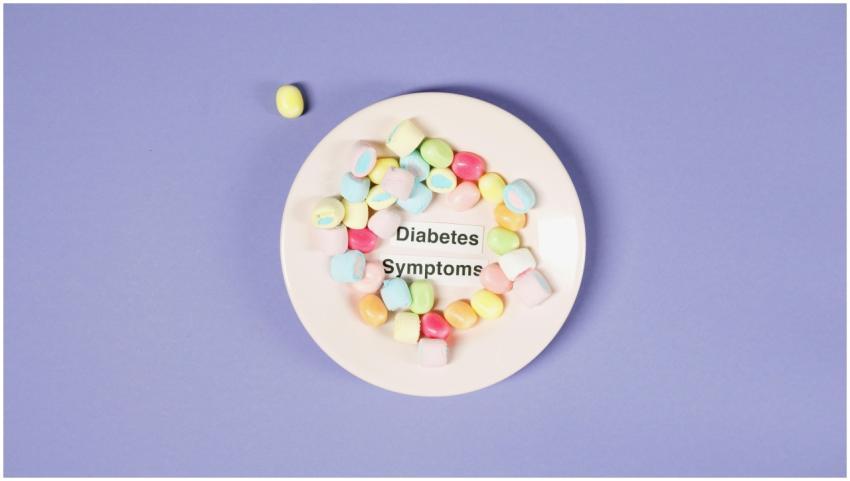 Colorful candies on a plate highlight diabetes sym