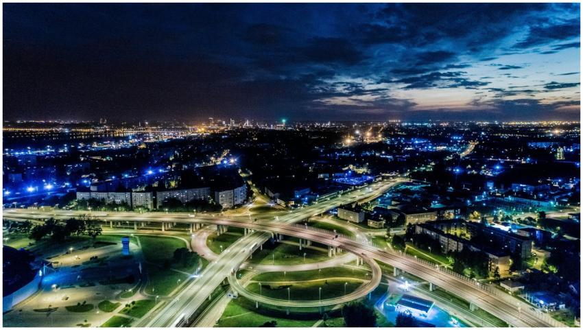 Vibrant cityscape aerial view of illuminated highw