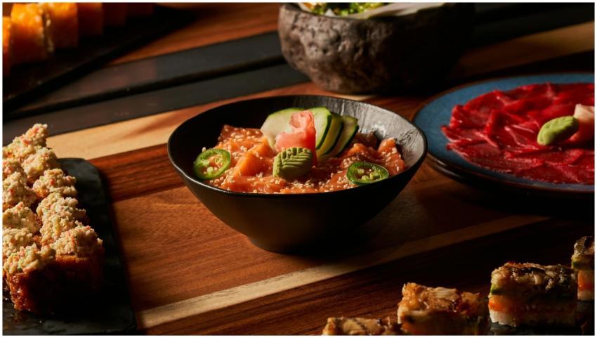 A vibrant assortment of Japanese sushi dishes incl