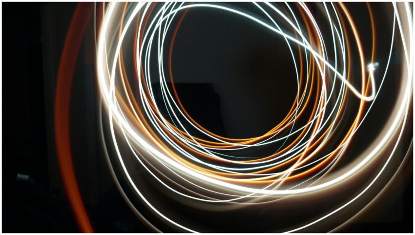 Dynamic long exposure shot of swirling light strea