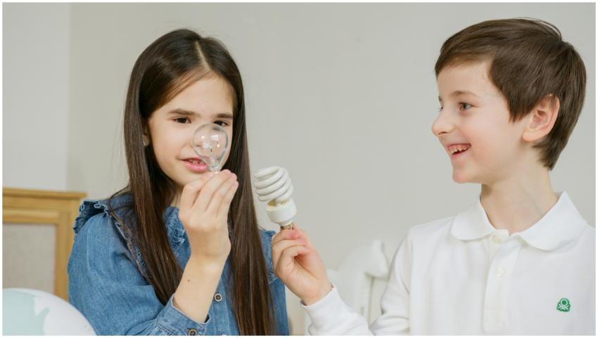 Two children learning about energy efficiency with