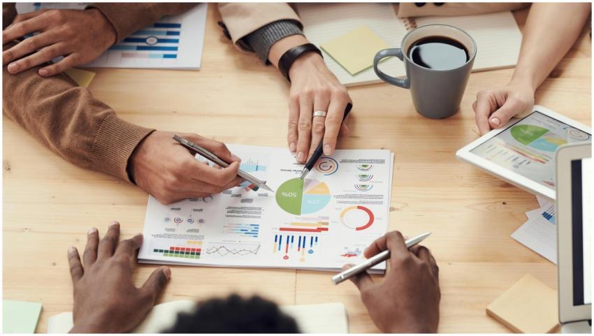 Colleagues discussing data and strategy in an offi