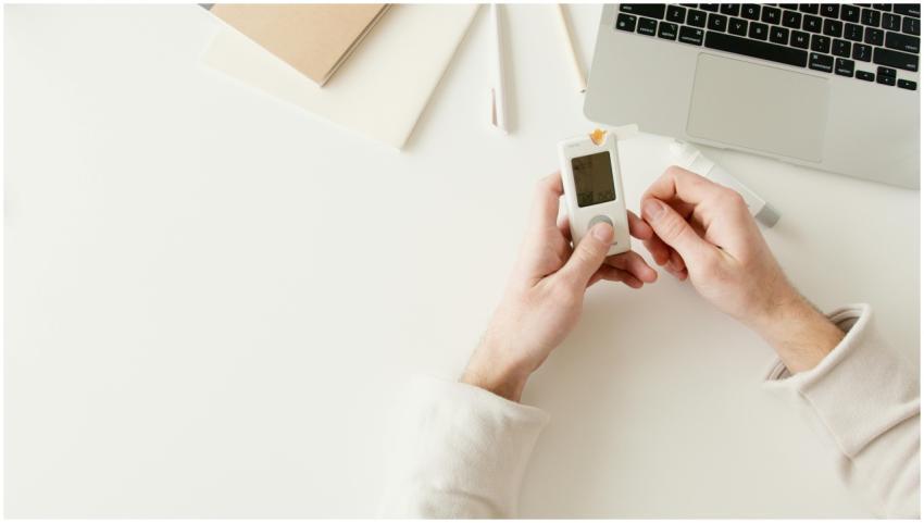 Person checking blood sugar with a glucometer on a