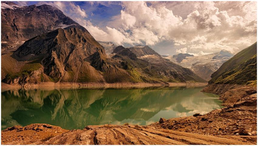 A breathtaking view of mountains reflecting in a t