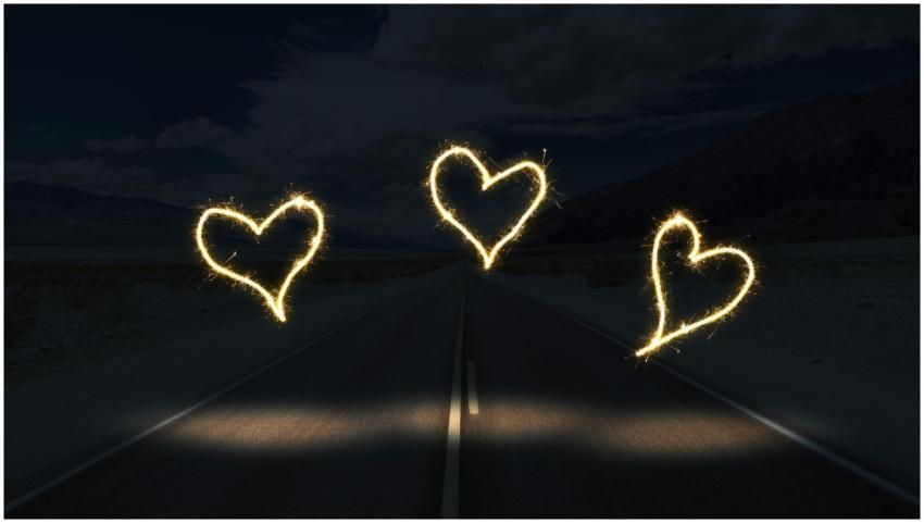Three illuminated heart shapes created with sparkl