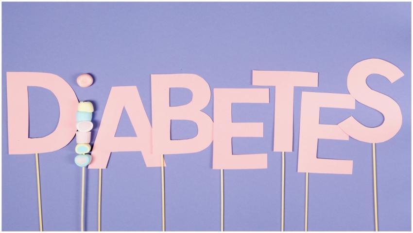 Pink paper letters spelling 'Diabetes' on sticks a