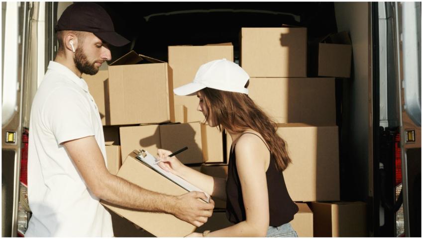 Courier team loading packages into a van, managing