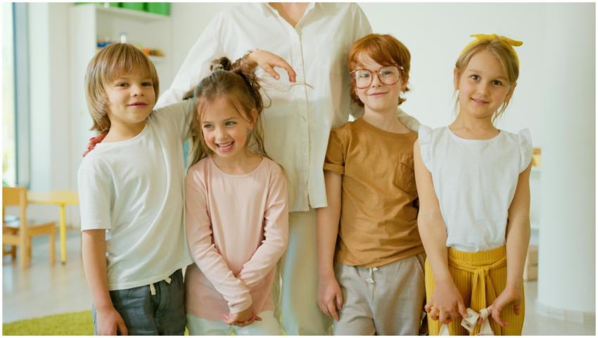 Joyful children posing indoors, smiling together i