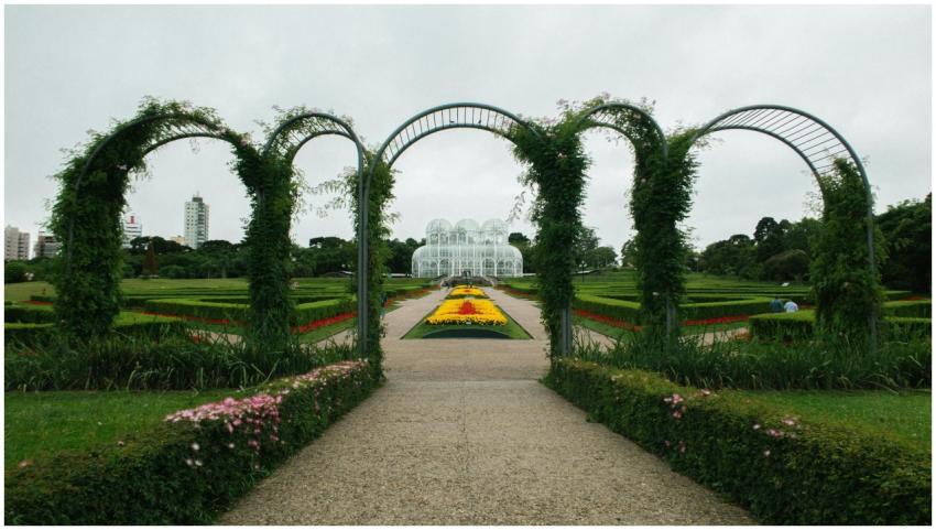 Beautiful garden with arches and vibrant flowers i