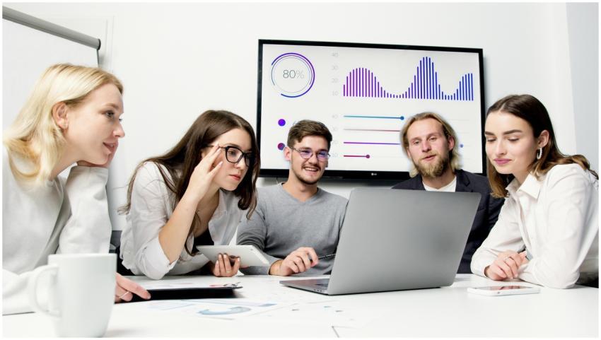 A diverse group of young professionals collaborati