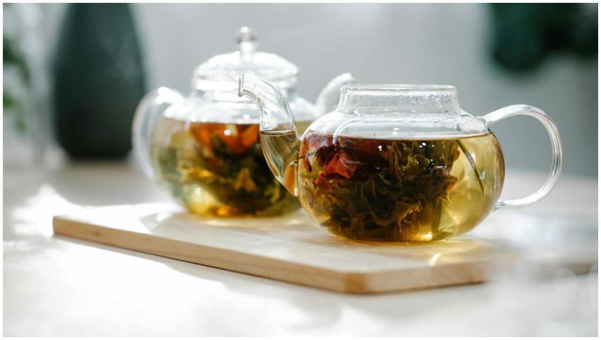 Close-up of herbal tea brewing in glass teapots pl