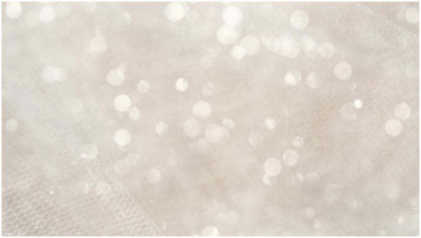 Soft focus white bokeh lights creating a magical,