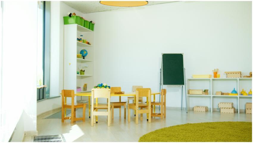 A well-lit, colorful kindergarten classroom with c