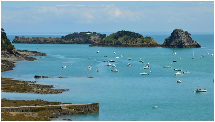 Scenic view of boats in the vibrant blue waters of