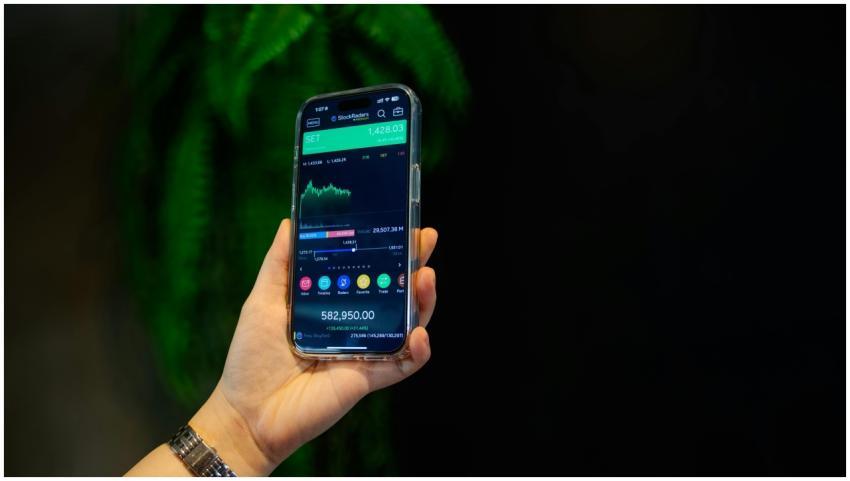 Close-up of a smartphone displaying a stock tradin