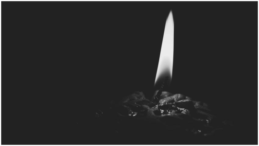 A captivating black and white close-up of a candle