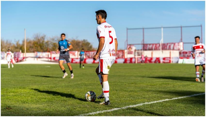 Soccer player in action during a daytime match on