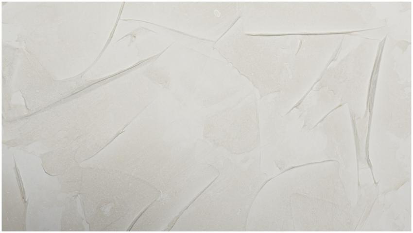 Cream textured abstract wall pattern ideal for bac