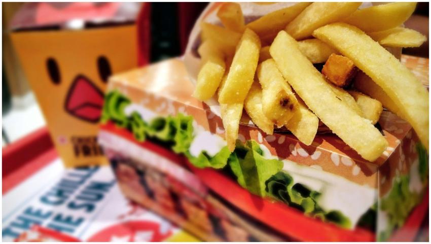 Crispy french fries served on a fast food tray wit