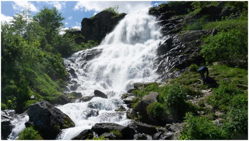 Stunning cascade waterfall amidst lush greenery in