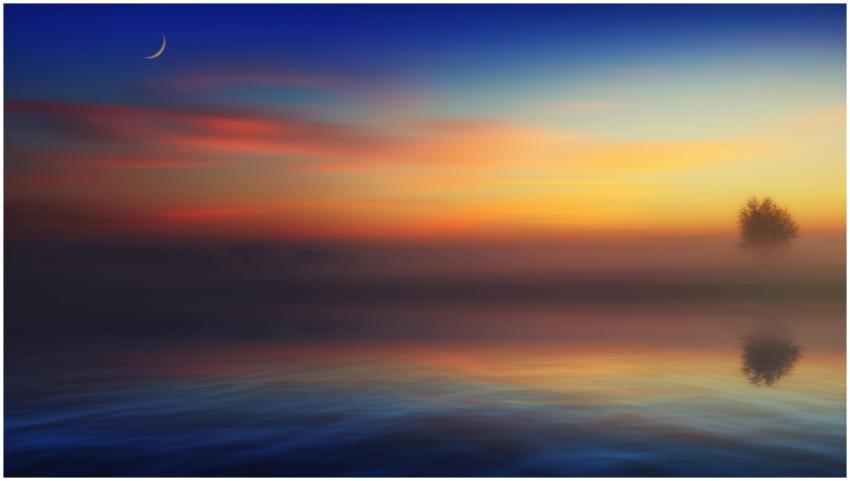 A tranquil scene depicting a colorful sunrise over