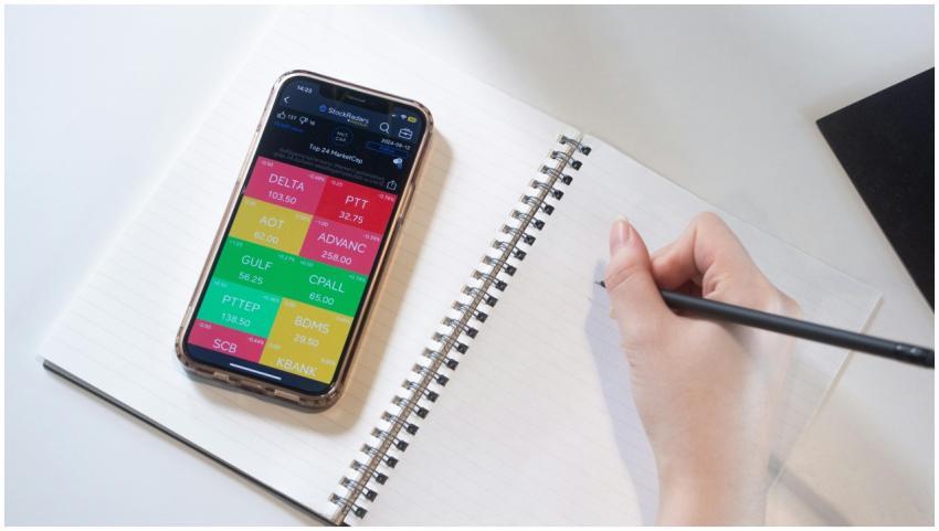 Close-up of a smartphone displaying stock data bes