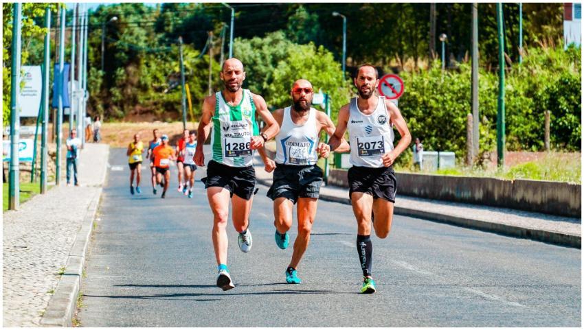 Group of men competing in a marathon on a sunny da