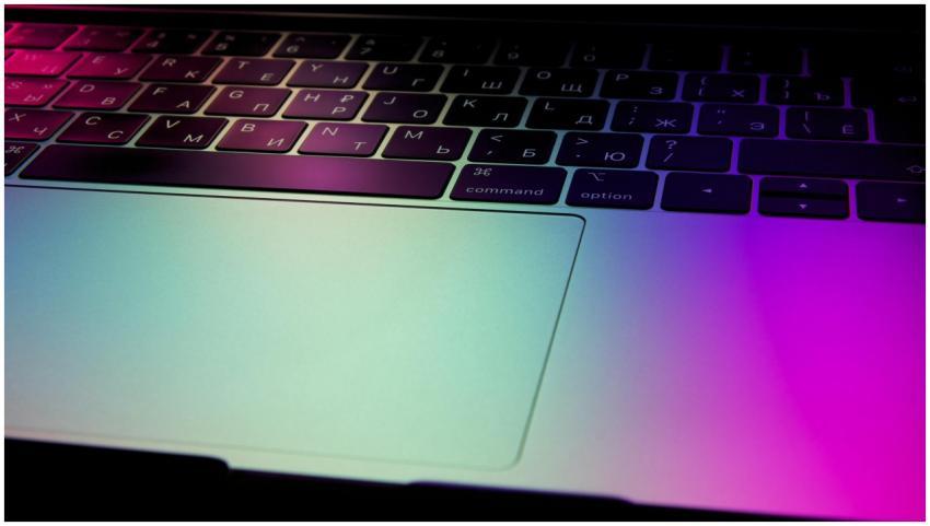 Vibrant close-up of a laptop keyboard illuminated