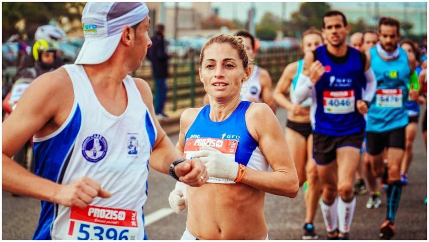 A group of marathon runners competing in an outdoo