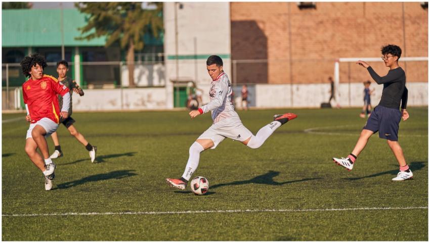 Energetic soccer match with teenagers competing on