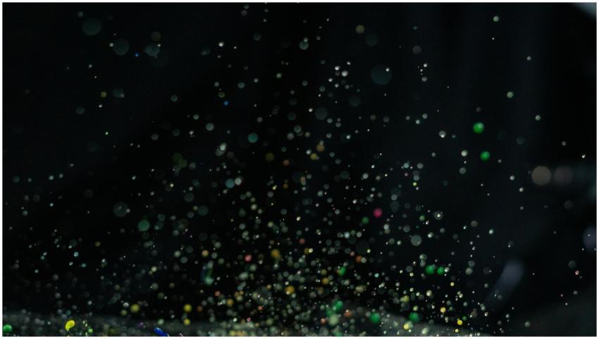 Vibrant multicolor paint splatter captured in moti