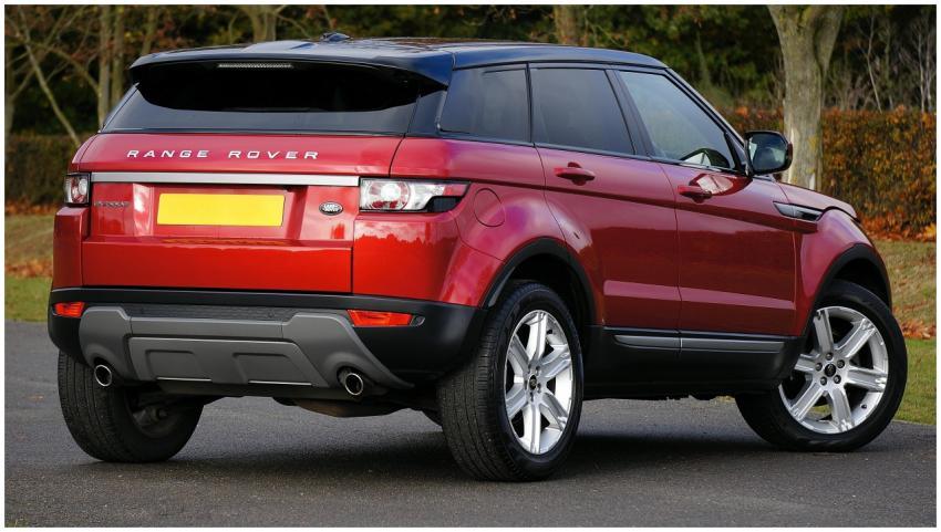 Elegant red Range Rover SUV parked outdoors on a c