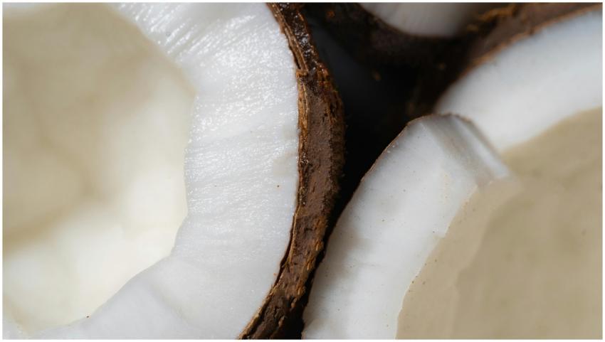 A detailed close-up of fresh coconut shells showca