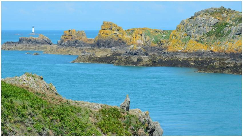 A stunning coastal landscape featuring rocky cliff