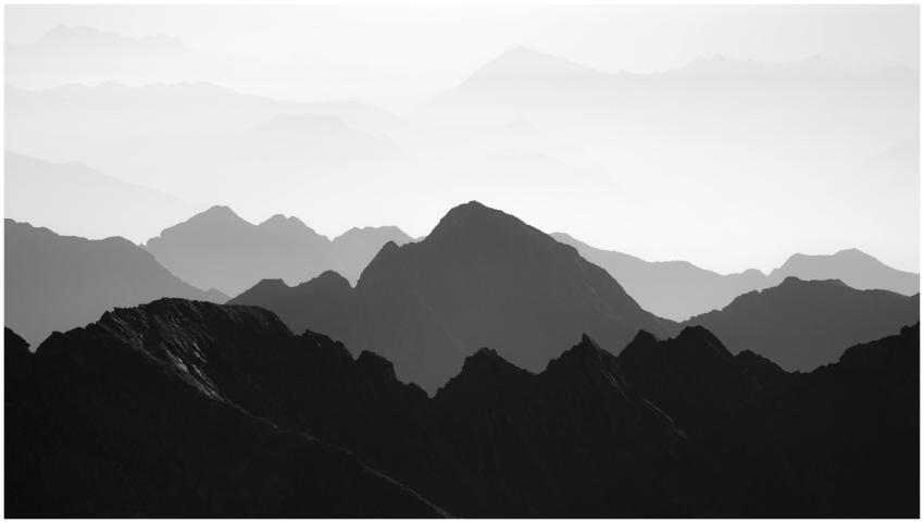 Black and white image of layered mountain silhouet