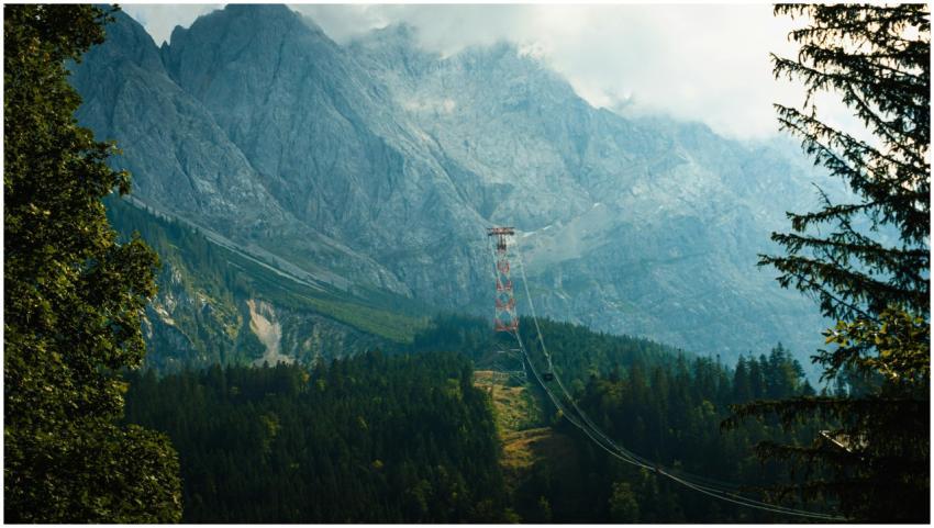 Mystical mountain landscape featuring a cable car