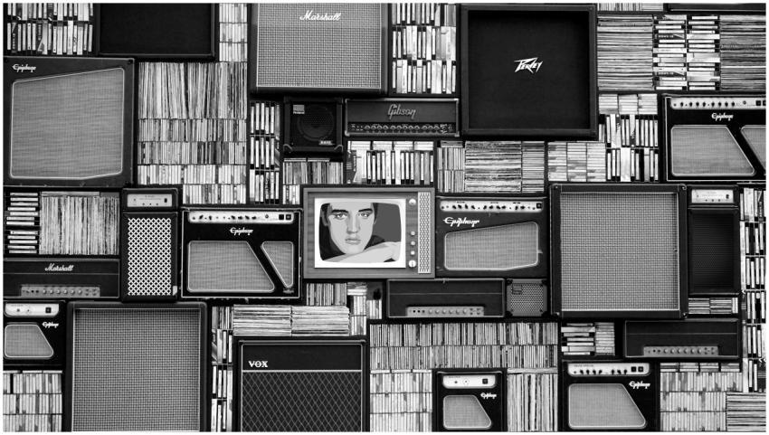 Vintage amplifiers and vinyl records arranged in a