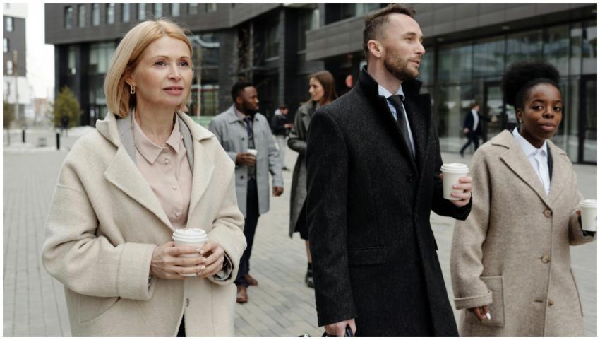 Group of diverse business professionals walking ou